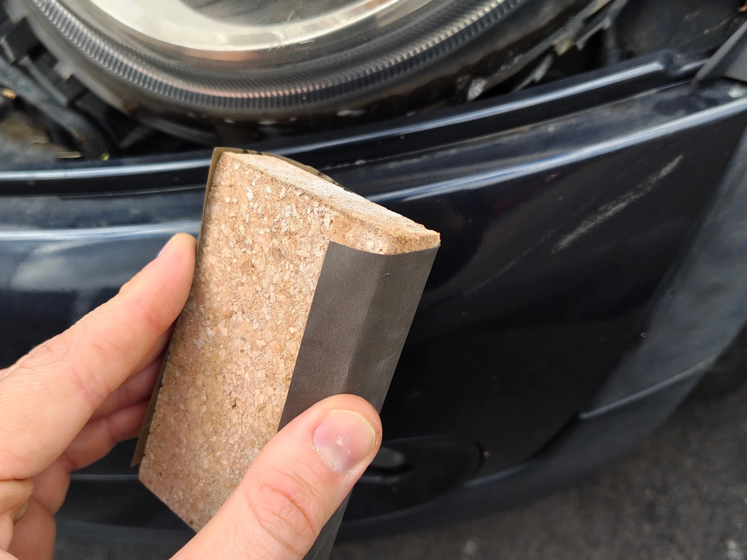1200 grit sandpaper wrapped around a sanding block