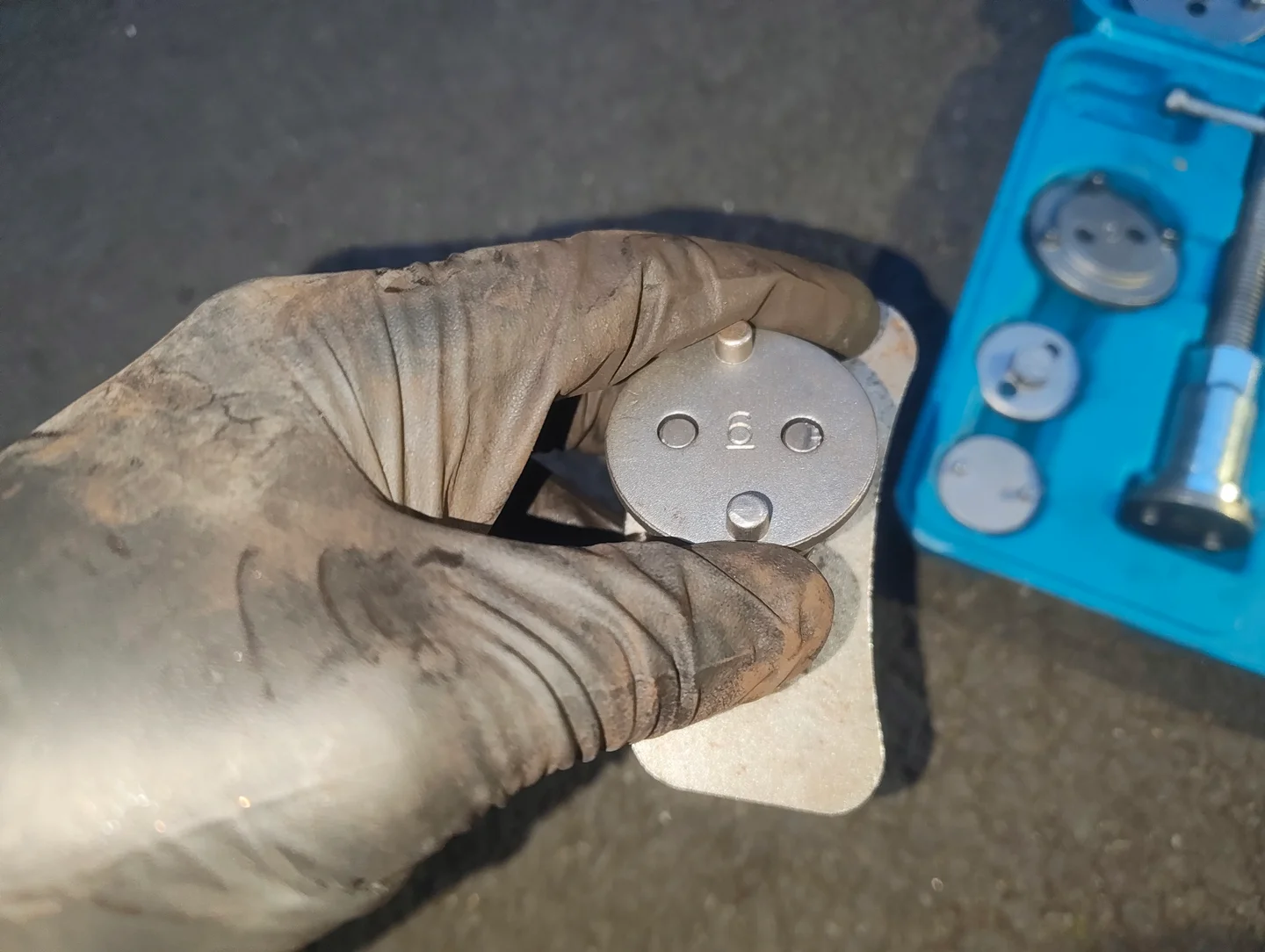 After placing adapter on brake caliper piston retraction tool