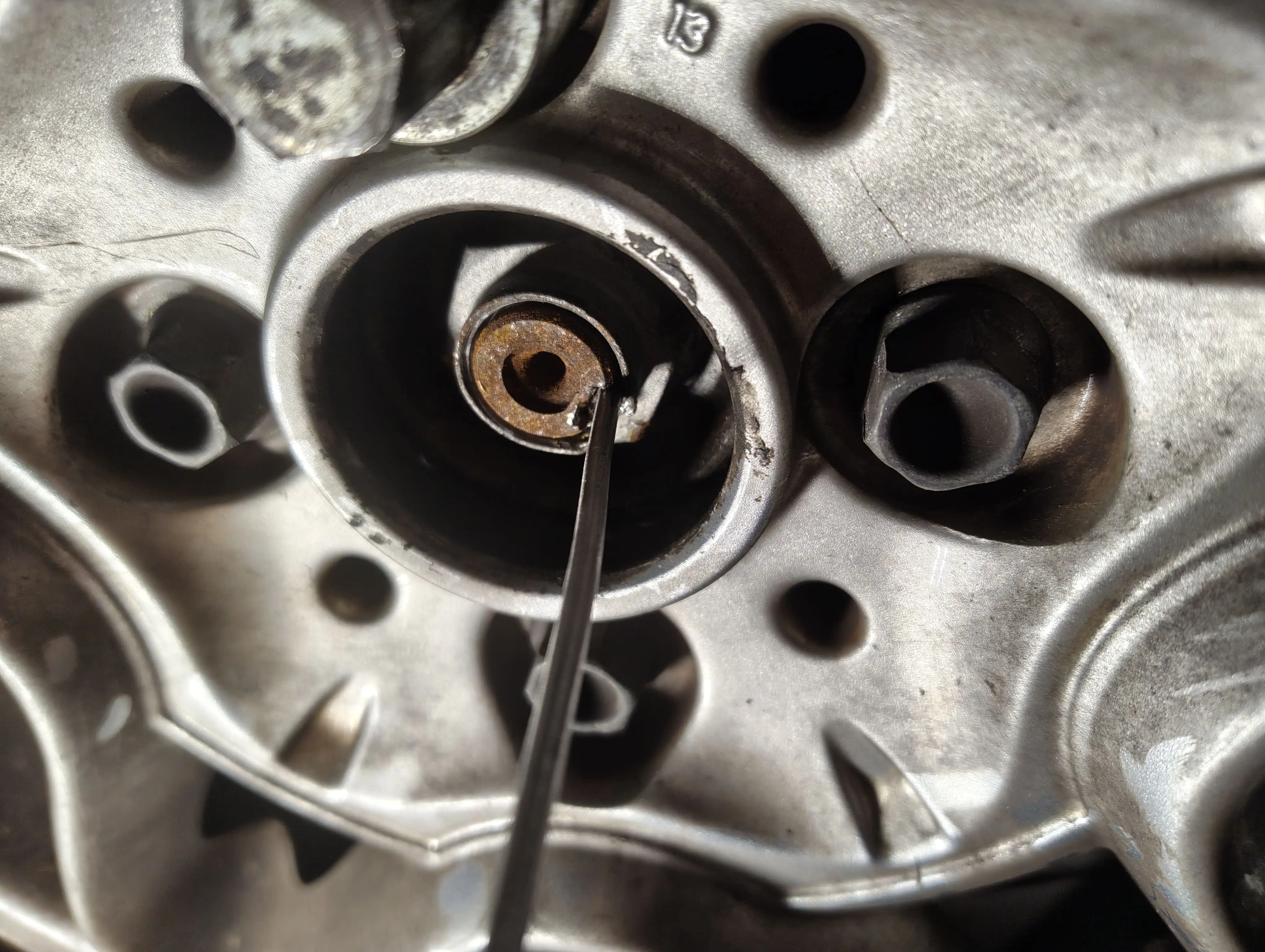 Before hammering the driveshaft nut indentation with a hammer and flathead screwdriver