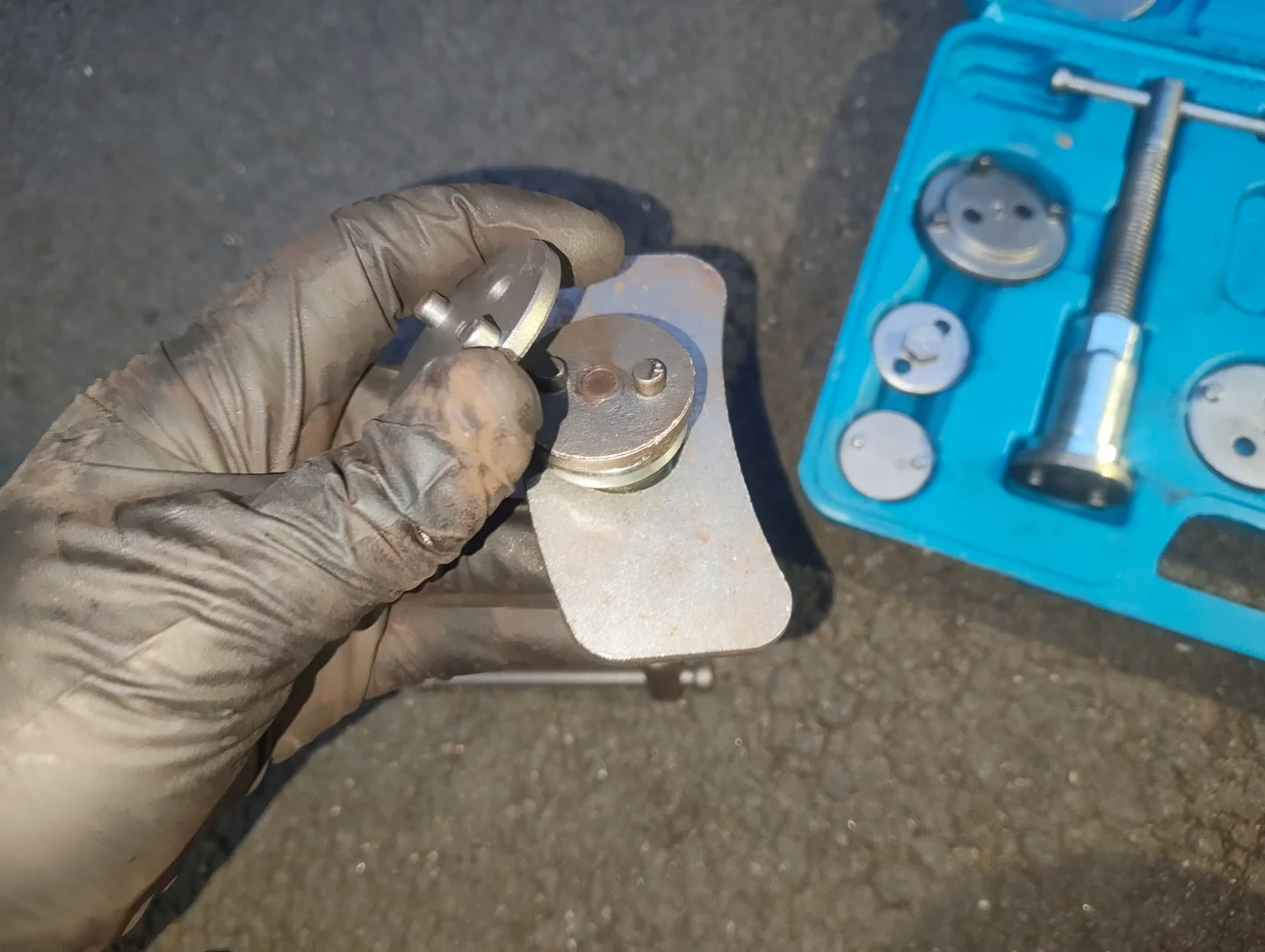 Before placing adapter on brake caliper piston retraction tool