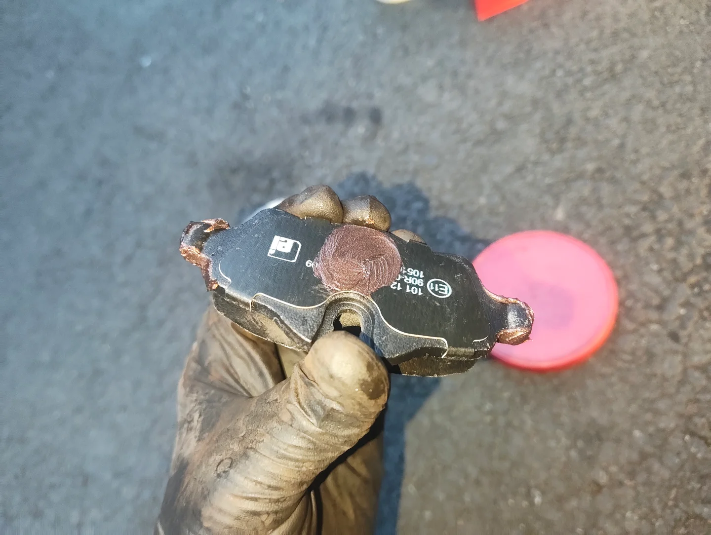 Copper grease on the rear of a brake pad