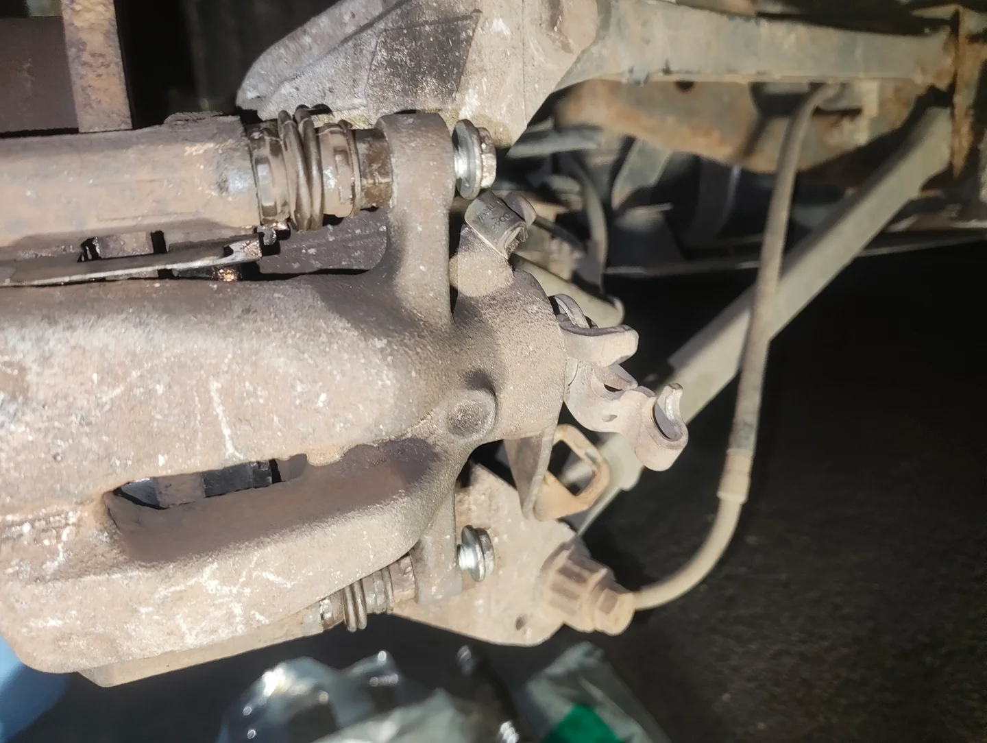 Partially installed brake caliper fixing bolts