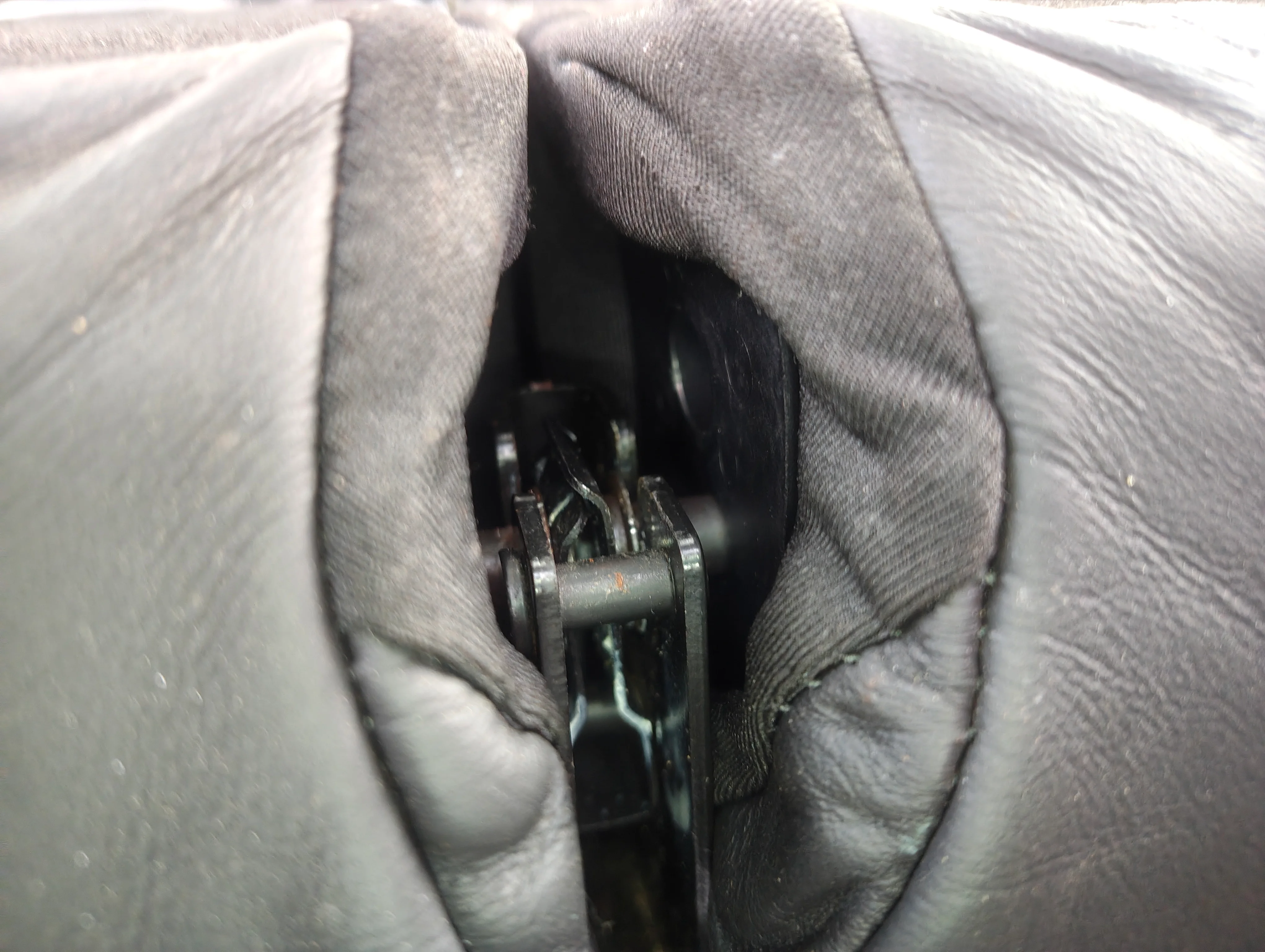 Partially popped out rear seat stud