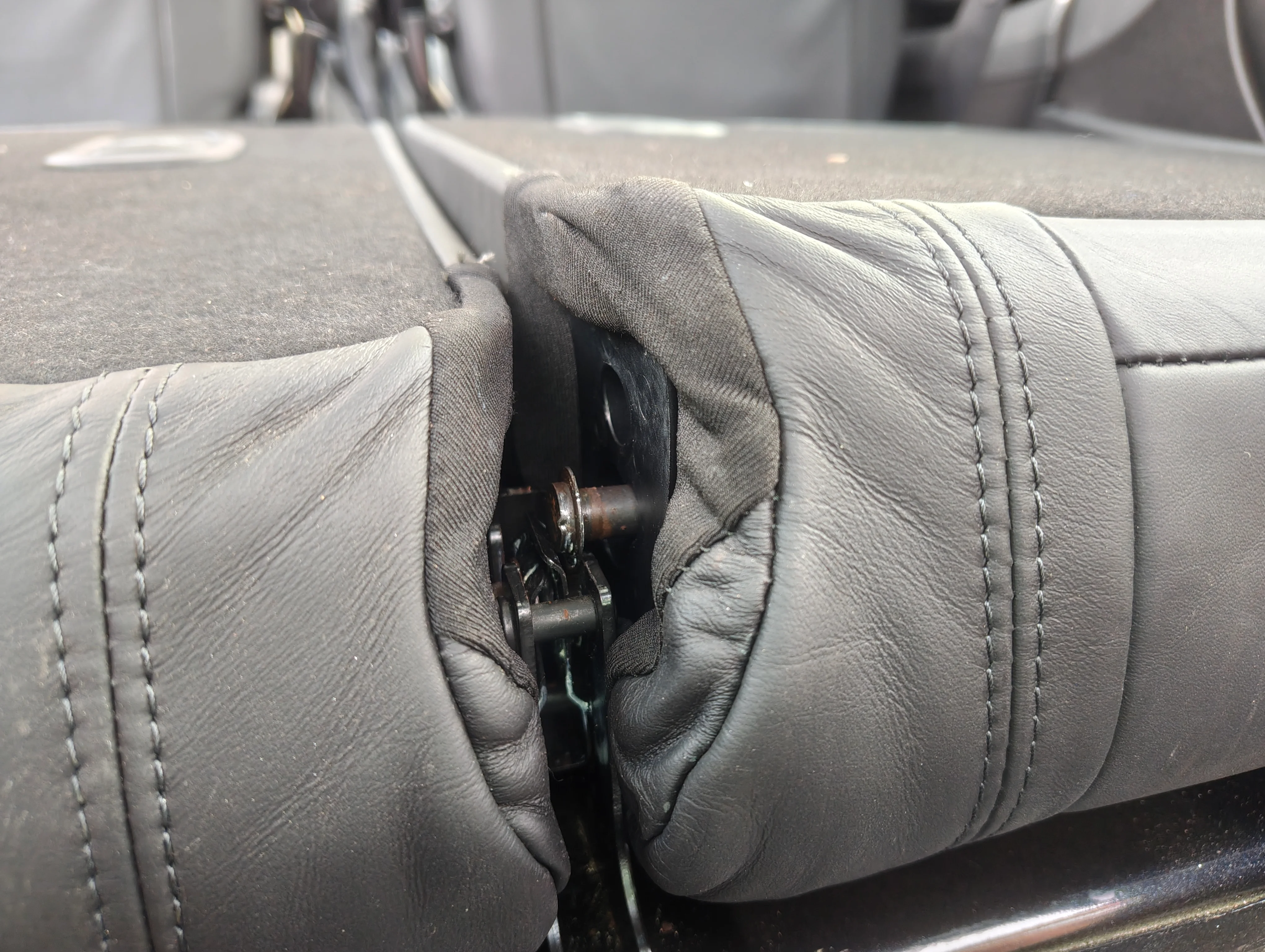 Popped out rear seat stud