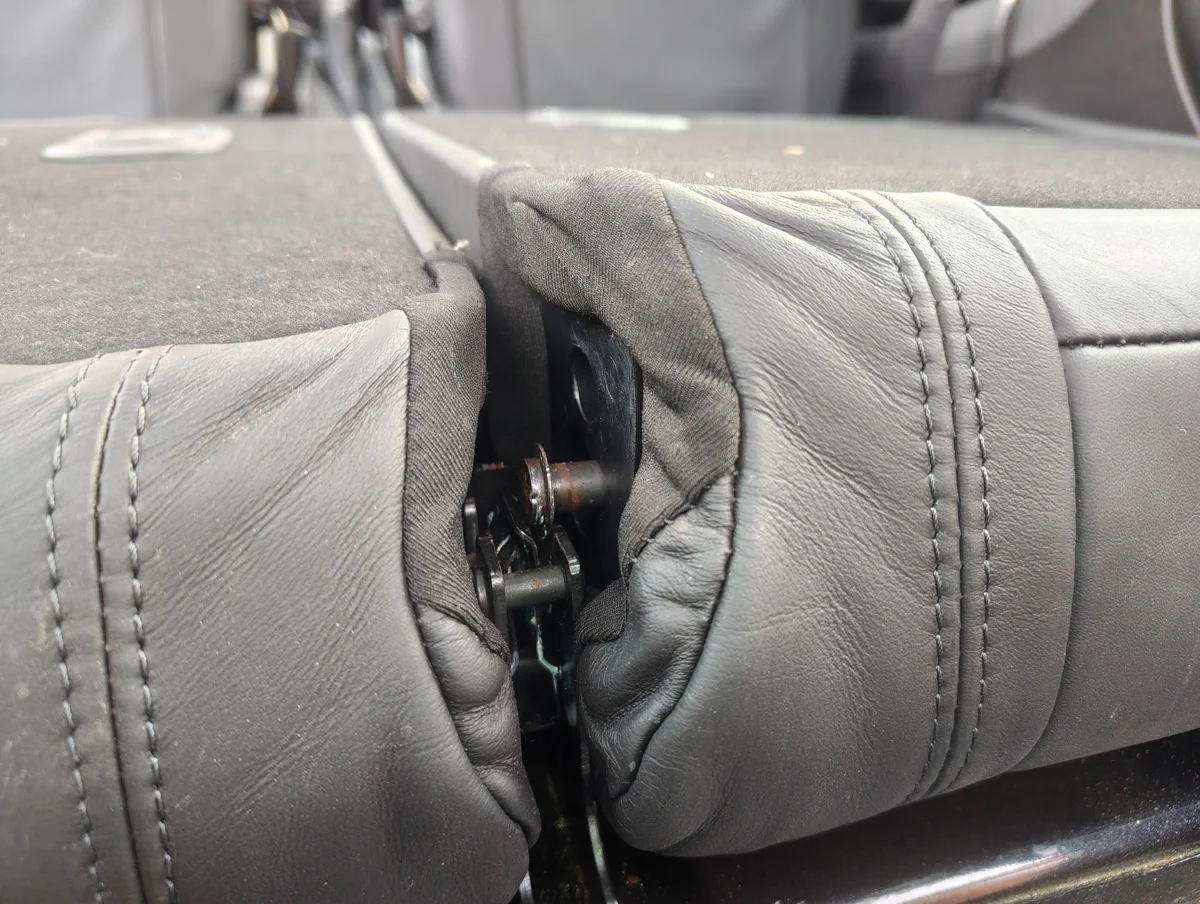 Popped out rear seat stud