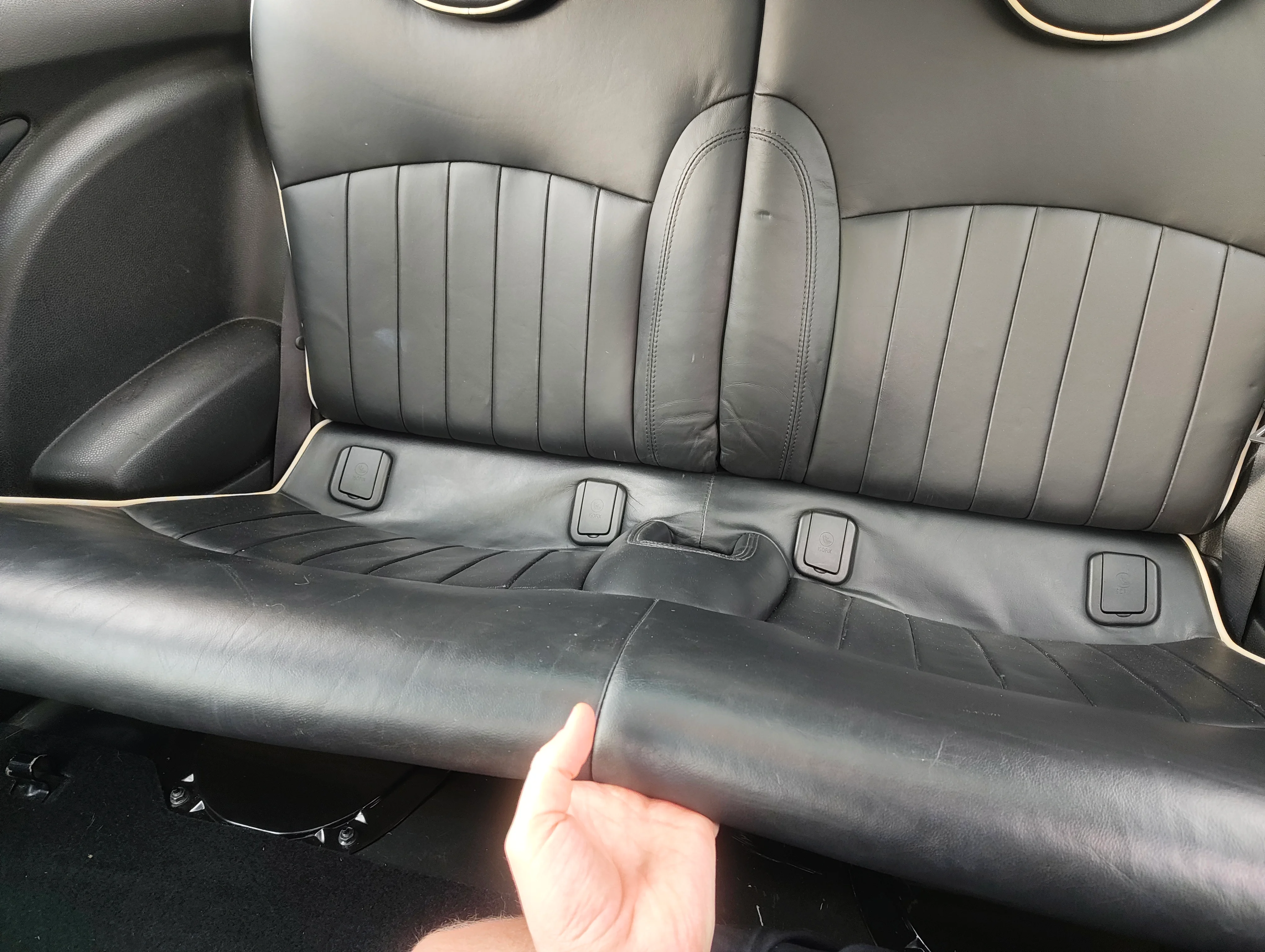 Pulling rear seat bottom out