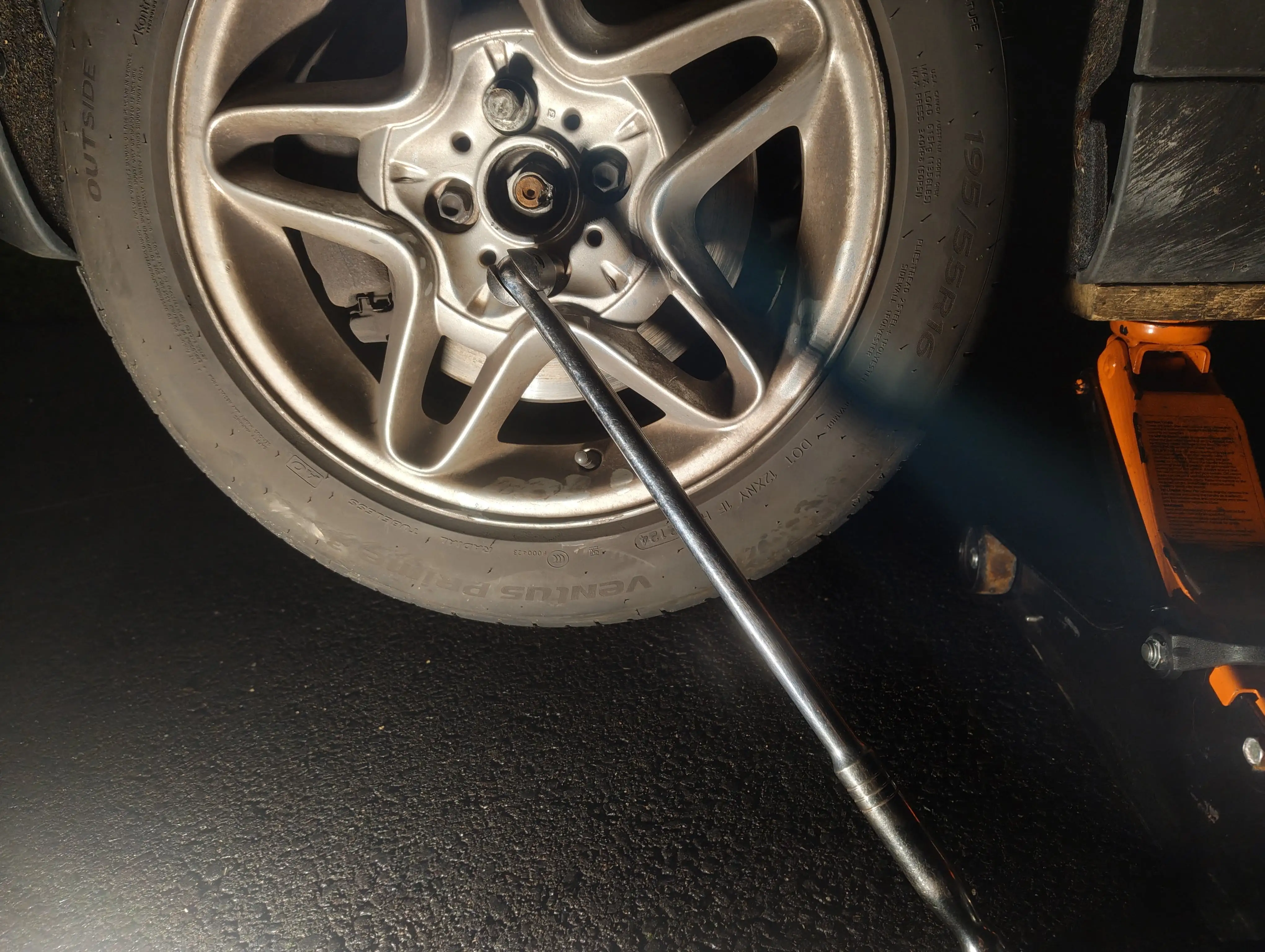 Removing the front passenger-side lug nuts