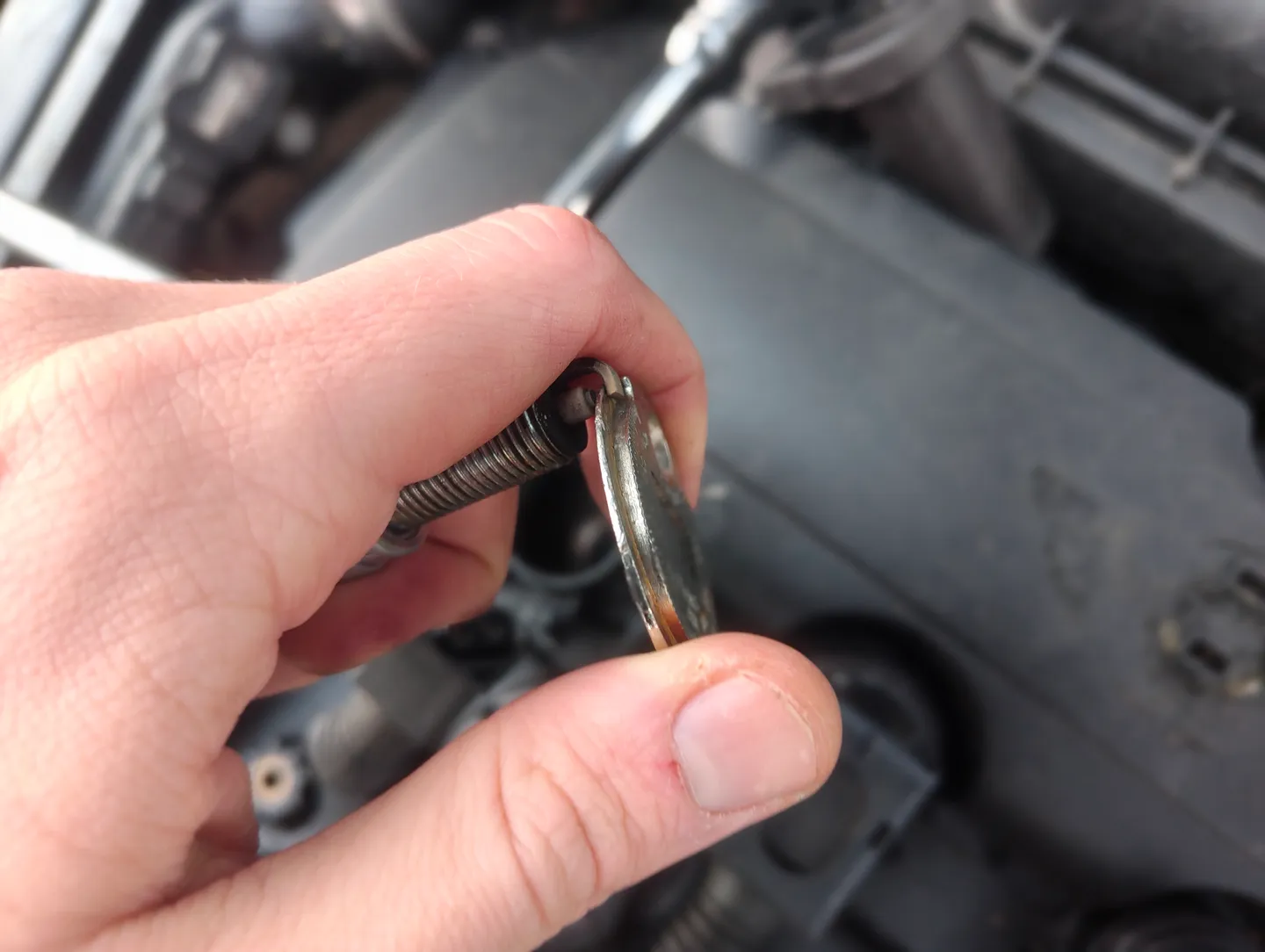 Spark plug on spark plug gauge tool