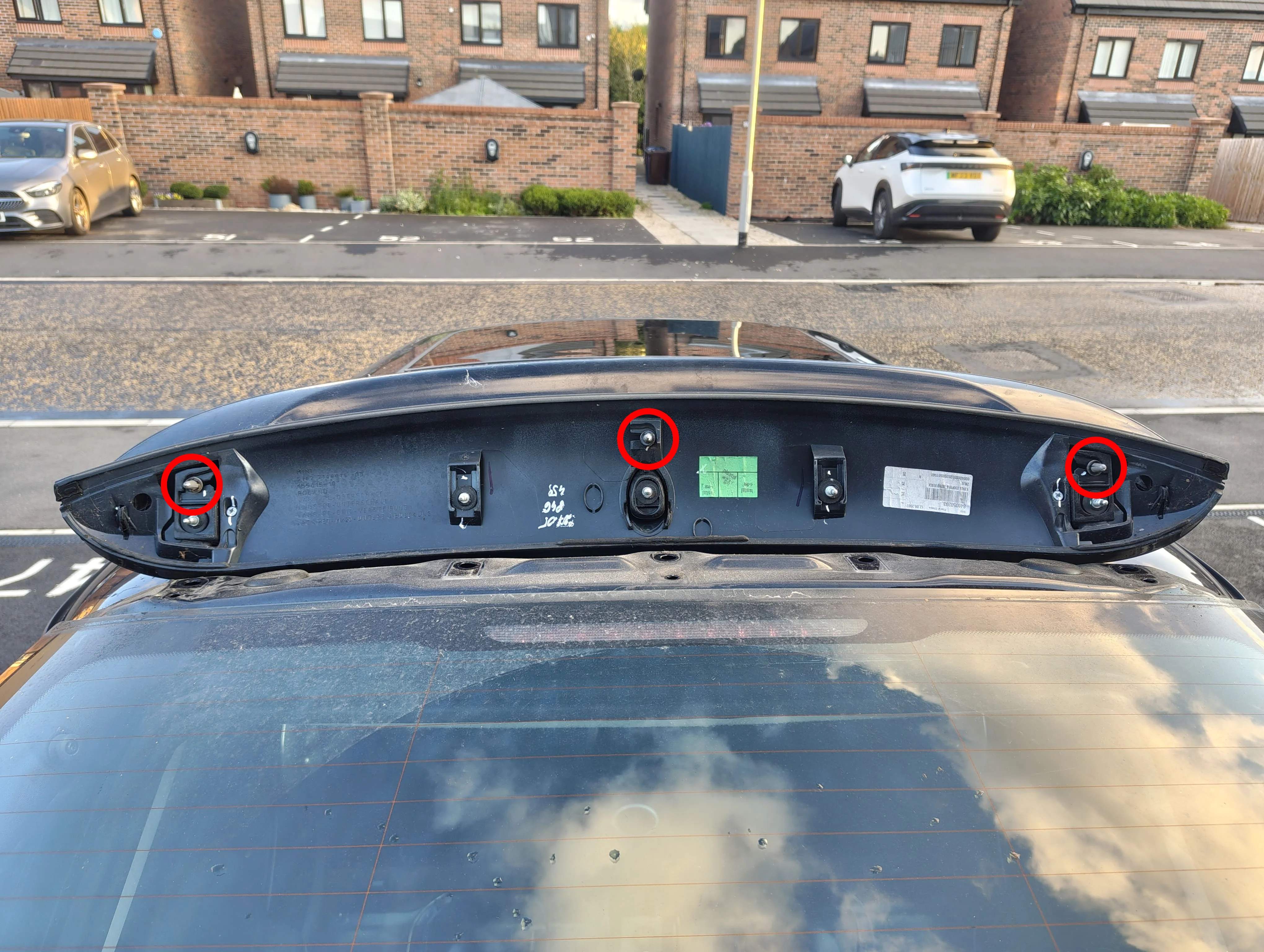 Spoiler on top of roof with rivets circled