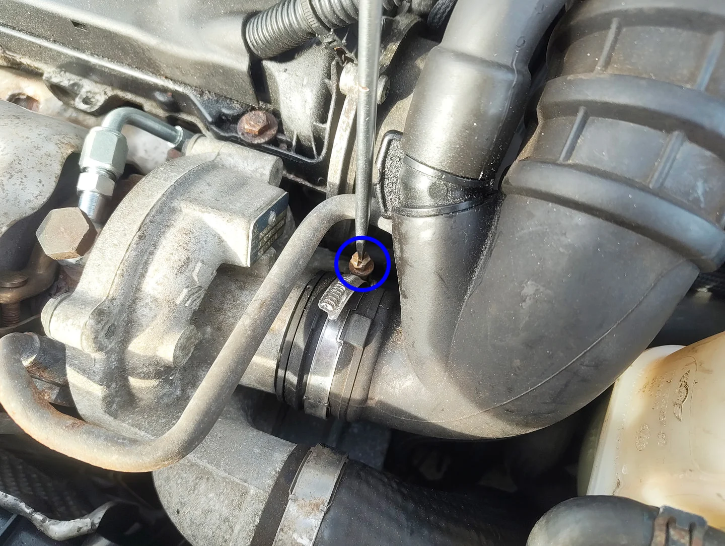 Unscrewing boost intake hose clamp