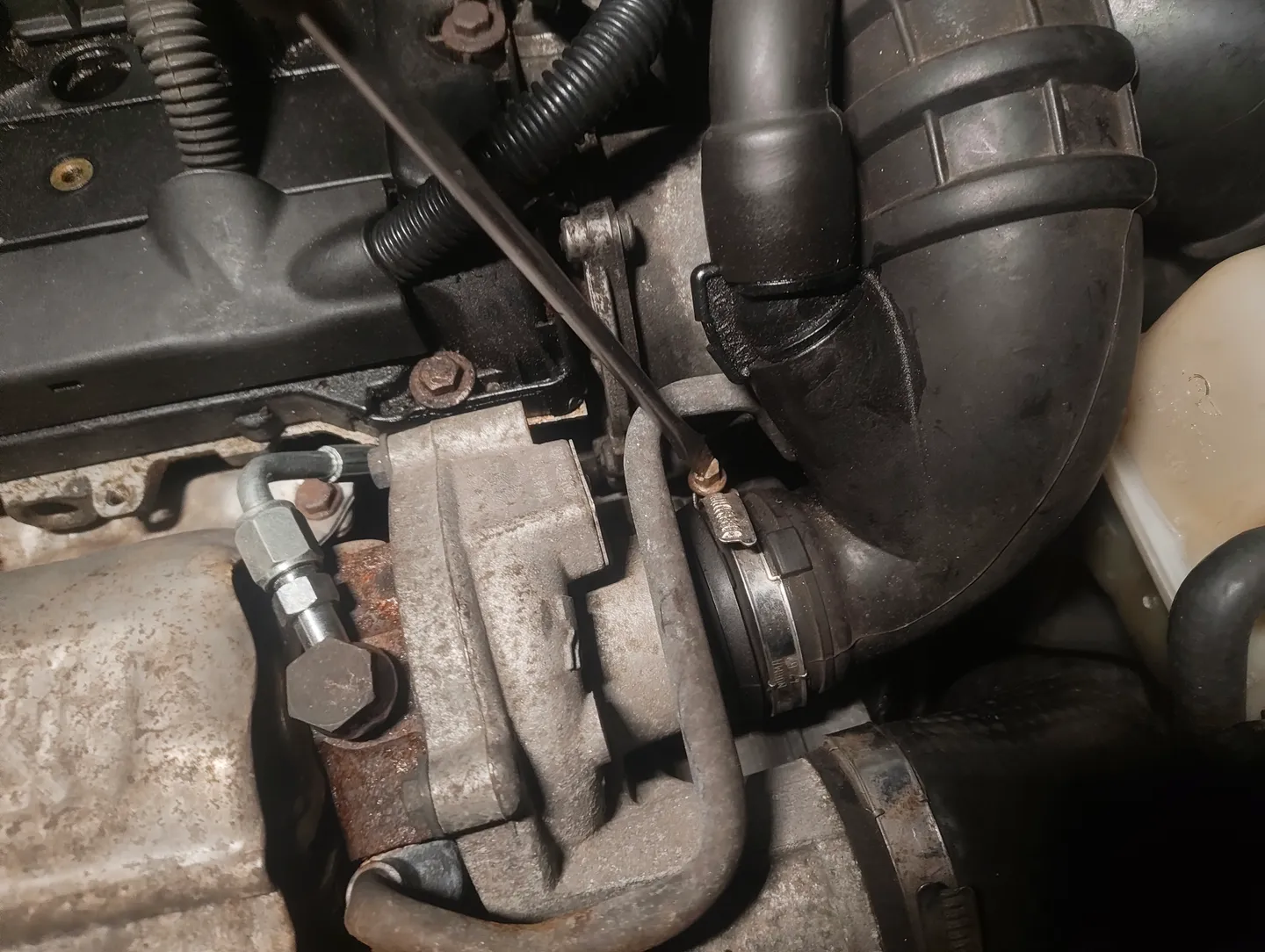 Unscrewing bottom of boost pipe