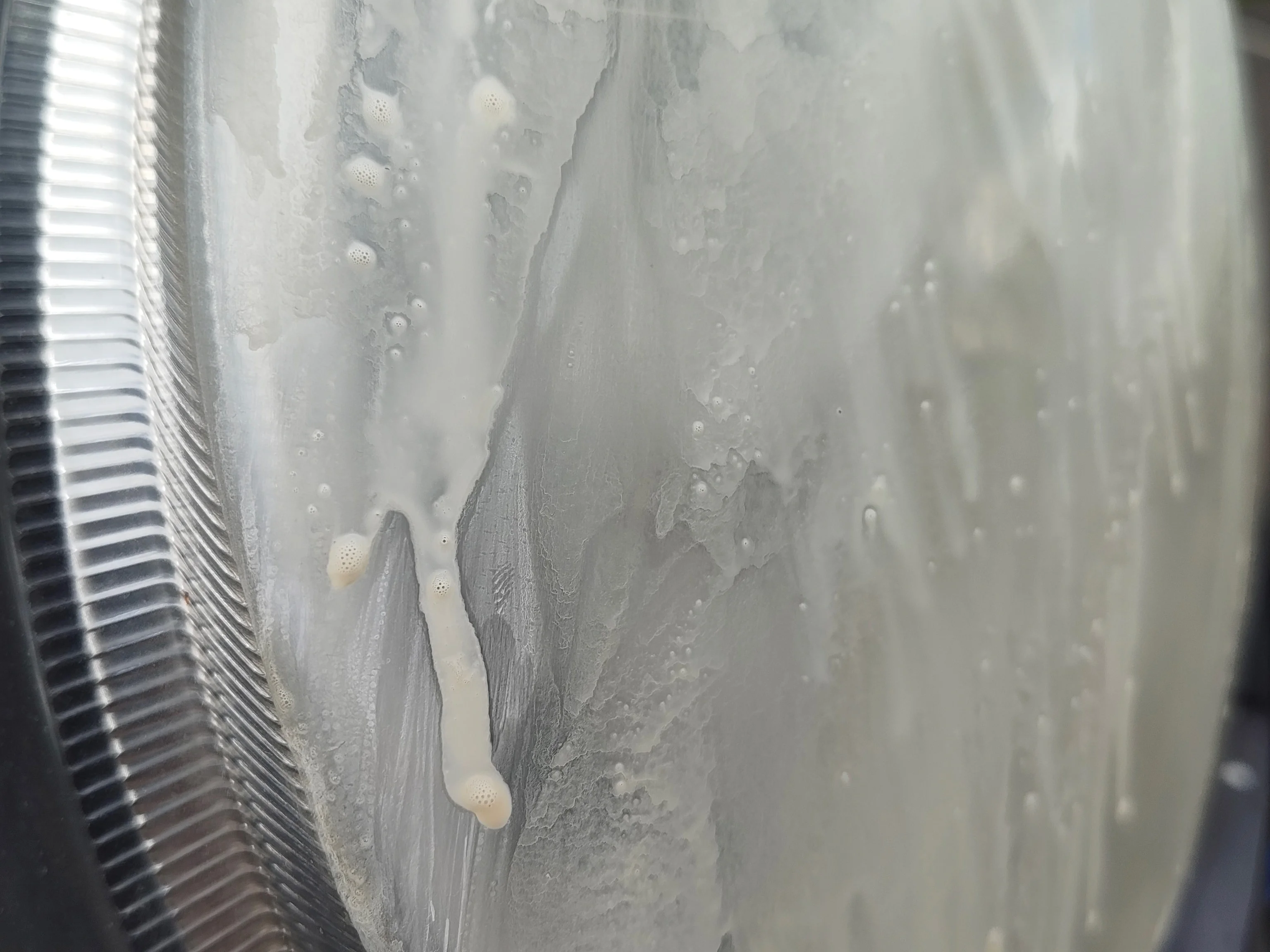 Yellow milky residue after 1200 grit sandpaper wet sanding