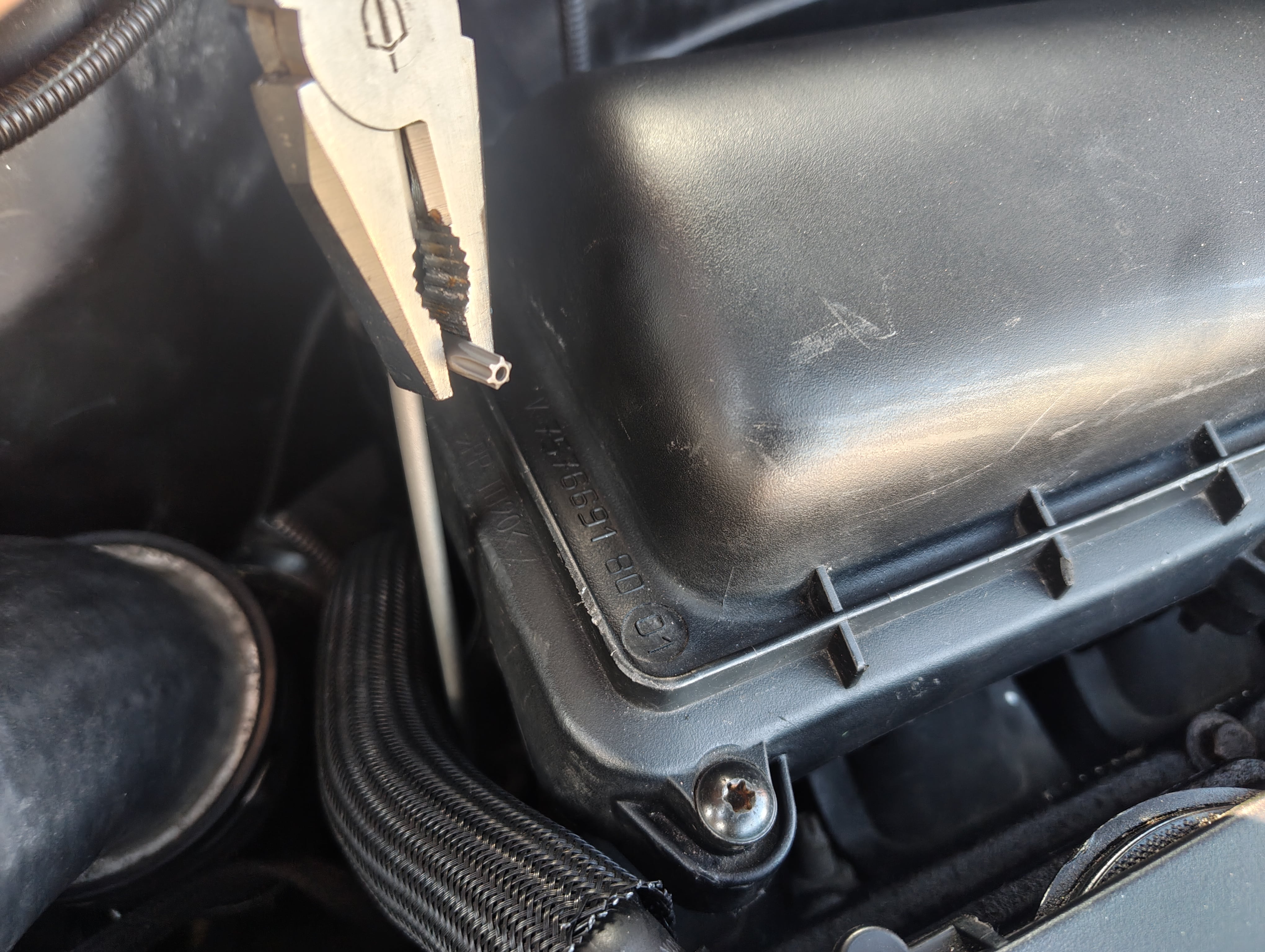 Torx 25 key being turned with pliers